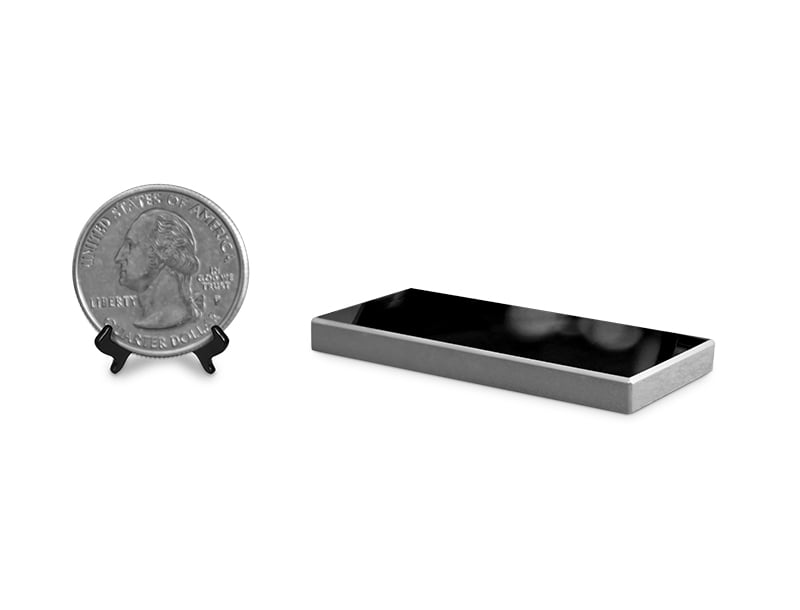 Max-Flux TXRF optics - Focusing graded multilayer monochromator (white background, with quarter for scale)