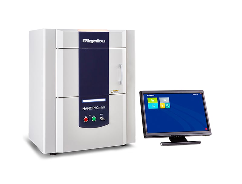 NANOPIX mini benchtop SAXS instrument with doors closed beside monitor