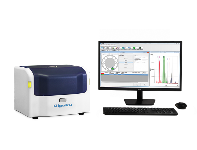 Rigaku NEX DE benchtop EDXRF elemental analyzer with a desktop computer.