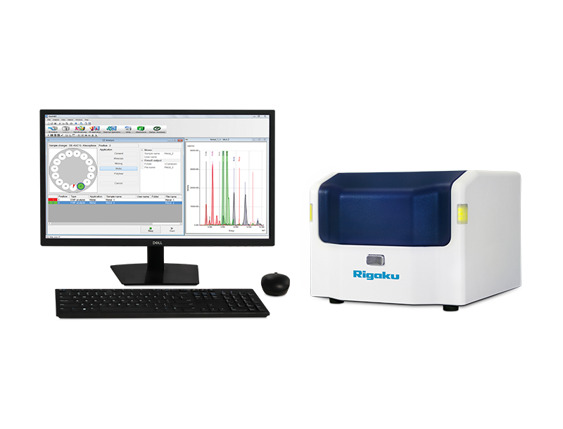 Rigaku NEX DE Series benchtop EDXRF elemental analyzer with a desktop computer.